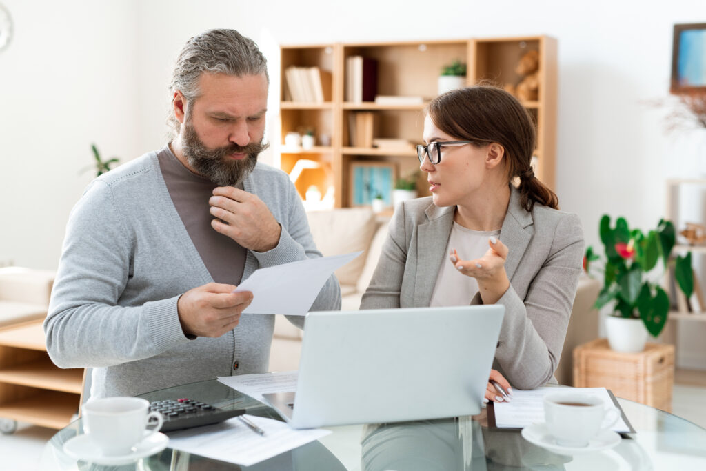 Financial counselor reviewing debt relief options with a client.